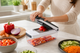 Trevisan 15-in-1 Vegetable Chopper — open with chopped carrots in container